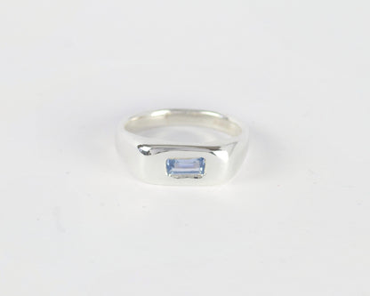 Top View of Light Blue Pillow ring in sterling silver by Meg Henry featuring a horizontal blue lab sapphire in a chunky sculptural signet-inspired design.