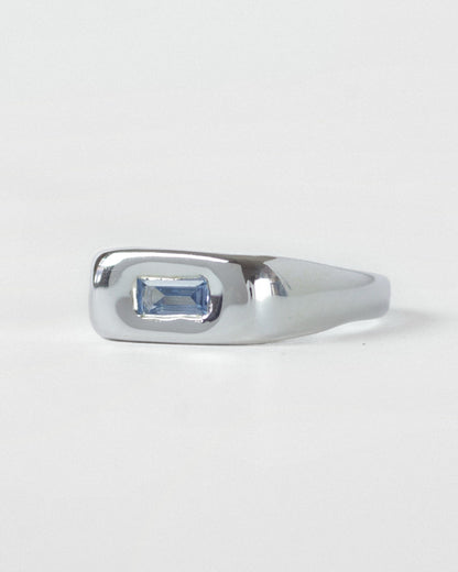 Light Blue Pillow ring in sterling silver by Meg Henry featuring a horizontal blue lab sapphire in a chunky sculptural signet-inspired design.